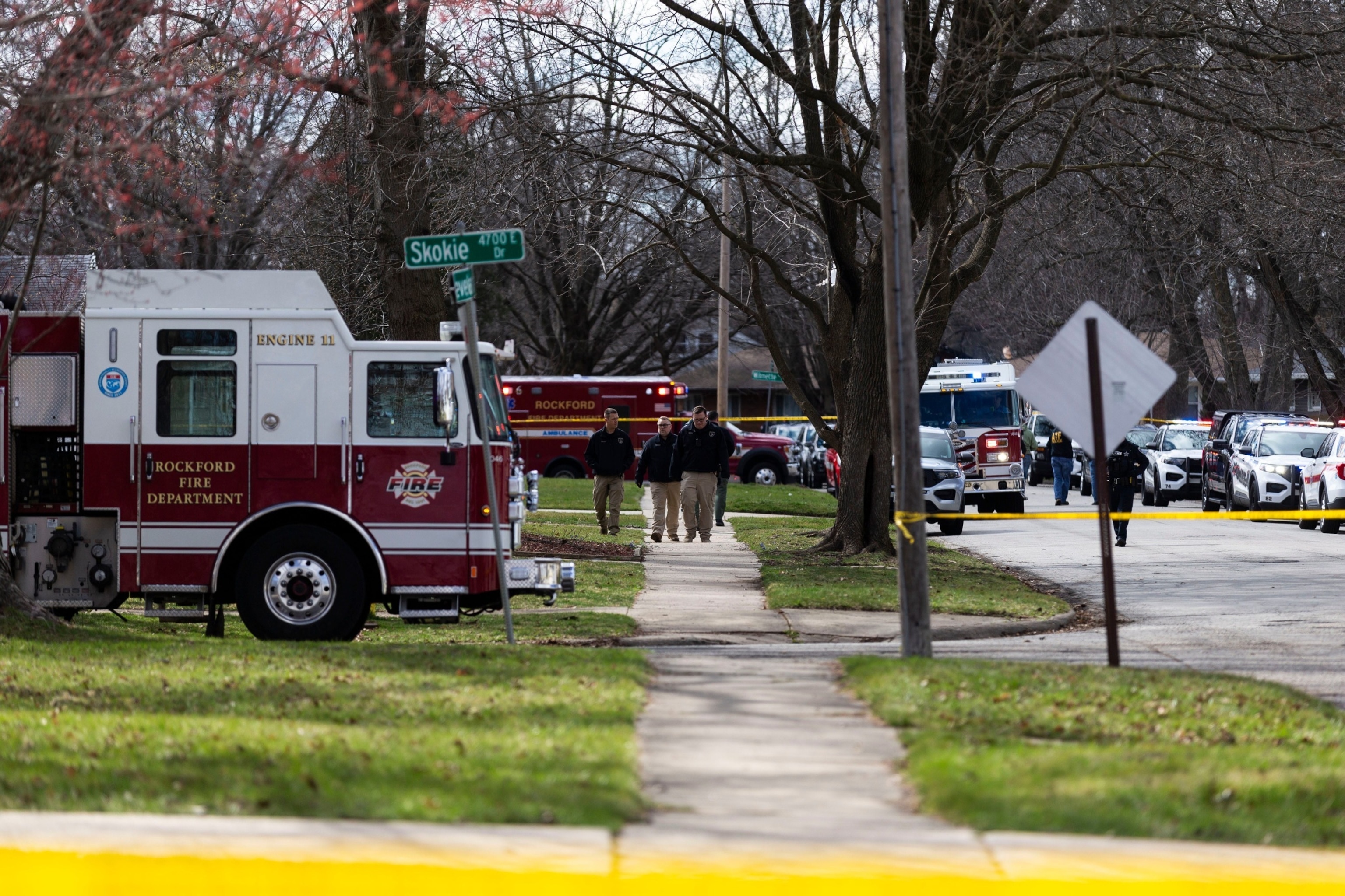 PHOTO: Police stand in the street after a stabbing incident on Cleveland Avenue on March 27, 2024, in Rockford Ill.